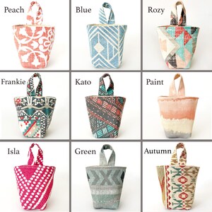 May include: Nine fabric doorstops in various colours and patterns. The doorstops have a handle at the top. Colours include peach, blue, rozy, frankie, kato, paint, isla, green, and autumn. Each doorstop has a unique design.