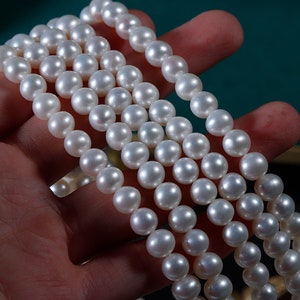 AAA+ 7mm nearly round white pearl strand