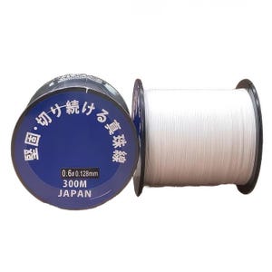 Może przedstawiać: Szpula białej żyłki wędkarskiej z niebiesko-białą etykietą z napisem "0.6# 0.128mm 300M JAPONIA". Etykieta zawiera r&oacute;wnież tekst japoński.