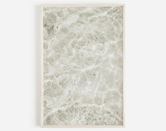 May include: A framed print of a white and gray abstract pattern resembling marble or stone.
