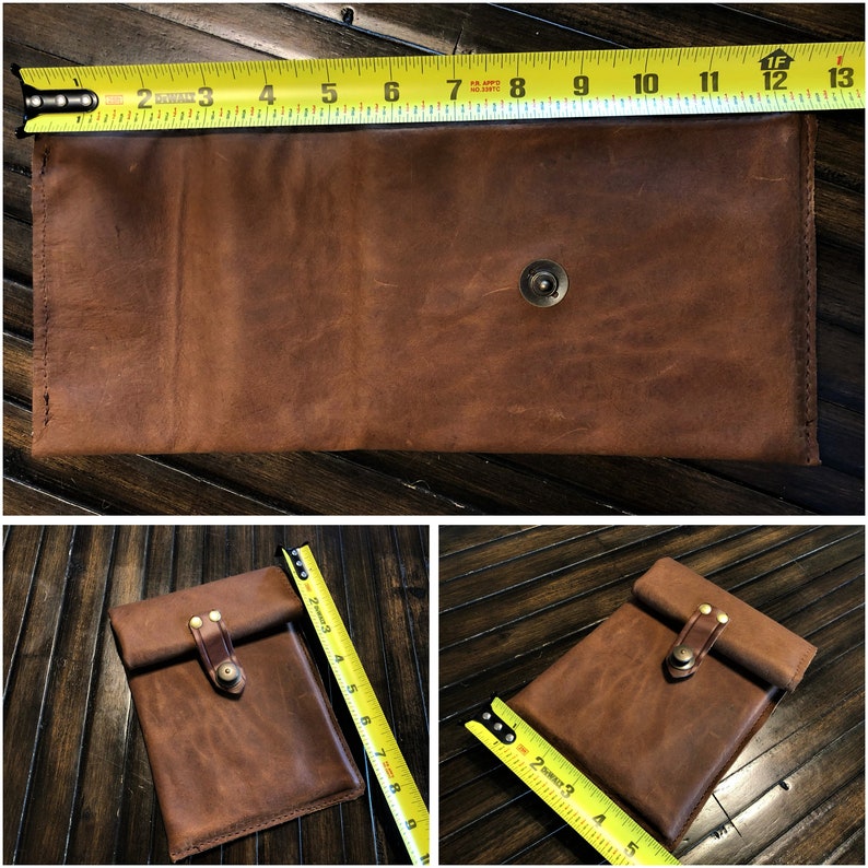 May include: A brown leather phone case with a flap closure and a brass button. The case is shown with a measuring tape, indicating its size.