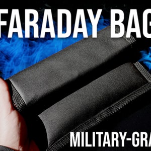 May include: Two black Faraday bags with the text "FARADAY BAG" and "MILITARY-GRADE" in white. The bags are rectangular and appear to be made of a durable, textured material. A hand is holding one of the bags, with a blue smoky effect in the background.