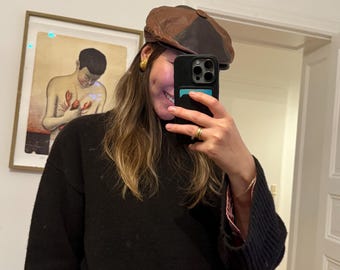 Brown leather newsboy cap