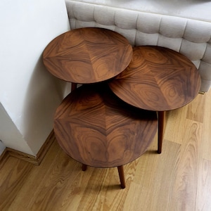 Round wooden nest of shop tables