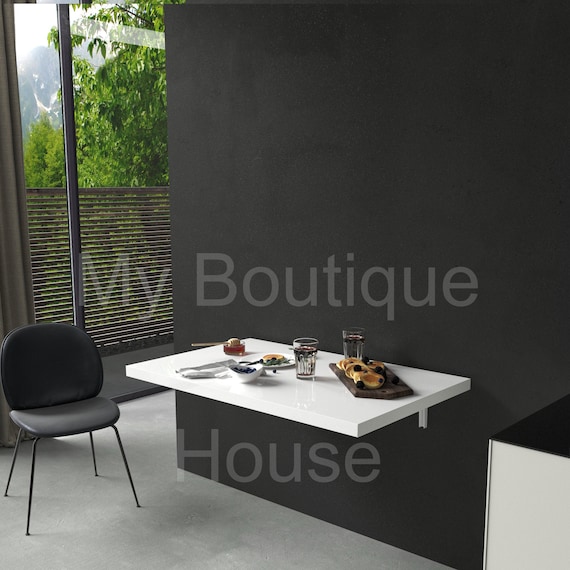 Wall mounted folding on sale glass dining table
