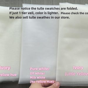 May include: Five tulle swatches in different shades of white, from left to right: Cold White (Blueish, seldom Use), Dark Ivory (Obvious yellow hue), Pure white/Off White/Milk White (No Yellow Hue), Ivory (Little Yellow Hue), and Champagne. The text "Please notice the tulle swatches are folded. If just 1 tier veil, color is lighter. Please check the colors under natural light. We also sell tulle swathes in our store." is written above the swatches.