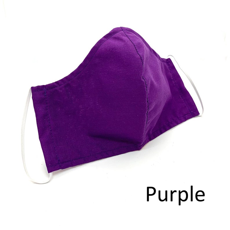 May include: Purple face mask with white elastic ear loops.