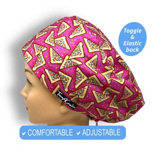 May include: Pink surgical scrub hat with a pattern of colourful sprinkles on a pink background. The hat has a toggle and elastic back. The hat is labelled "Tena Creations".