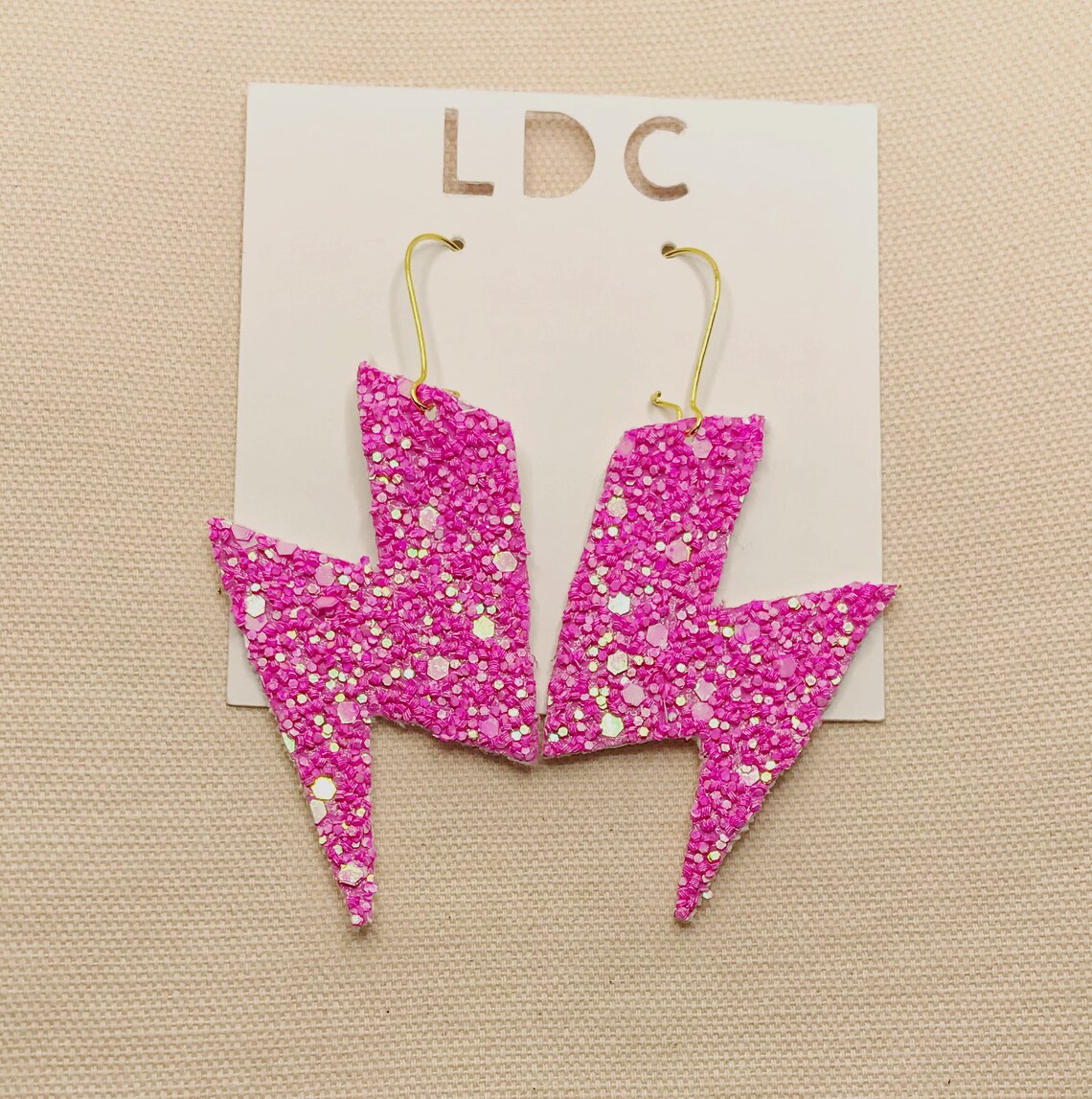 Statement 80s Neon Pink Glitter Lightening Bolt Earrings on image 0