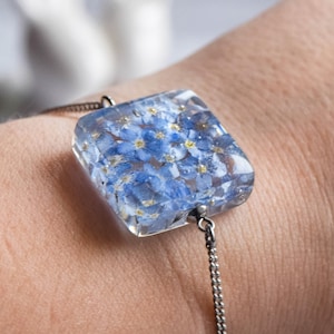 Botanical bracelet handmade with eco epoxy resin. Embedded in resin live plants, a real Blue Forget-me-nots flowers. Real flower jewelry.
