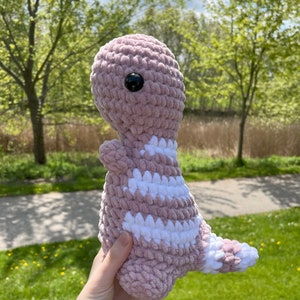 Crochet pink dinosaur plushie
