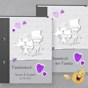 May include: Two gray and white photo albums with a black spine. The front cover of each album features a cartoon illustration of a bride and groom with hearts and the text "Familienbuch" and "Stammbuch der Familie".