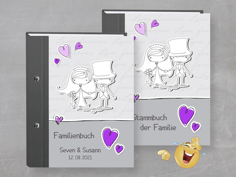 May include: Two gray and white photo albums with a black spine. The front cover of each album features a cartoon illustration of a bride and groom with hearts and the text "Familienbuch" and "Stammbuch der Familie".