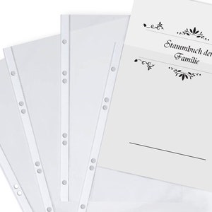 May include: Four clear plastic sheet protectors with holes for a binder. The sheet protectors are on top of a white sheet of paper with the text "Stammbuch der Familie" in black.