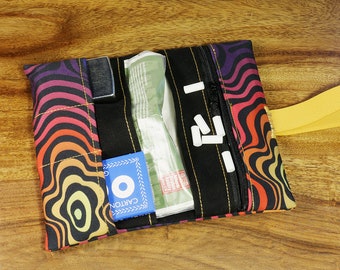 GOA tobacco pouch with psychedelic pattern, zippered pocket and compartments for smoking accessories; climate-neutral shipping; very little waste