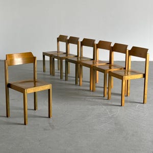 1 of 7 Vintage Stackable Constructivist Patinated Wooden Dining Chairs, Mid-Century Modern, 1970s Germany
