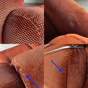 May include: Close-up detailed view of orange and black checkered fabric upholstery on a vintage modular sofa.  The image highlights slightly dented foam areas, indicated by blue arrows, showcasing minor wear and tear on the cushions. The chrome metal frame is also visible. The fabric shows a textured pattern and rich color.  The sofa exhibits mid-century modern design elements.
