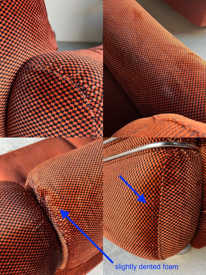 May include: Close-up detailed view of orange and black checkered fabric upholstery on a vintage modular sofa.  The image highlights slightly dented foam areas, indicated by blue arrows, showcasing minor wear and tear on the cushions. The chrome metal frame is also visible. The fabric shows a textured pattern and rich color.  The sofa exhibits mid-century modern design elements.