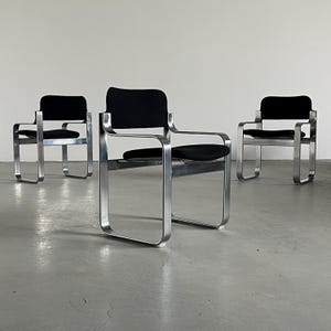 1 of 3 Vintage Armchairs by Eero Arnio for Mobile Italia in Chromed Steel and Black Fabric, 1970s Italy