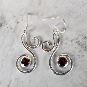 Sterling Silver Wire Wrapped Swirl Earrings With A Garnet Stone Accent!