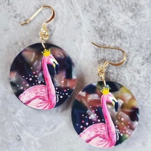 Super Cute Hand Painted Flamingo Earrings On A Round Tortoise Shell Background