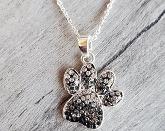Silver Paw Print Necklace Adorned With Black, Grey, & Clear Crystals on a 20" Silver Chain