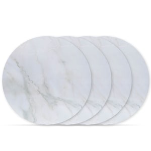 May include: Set of four round white marble-patterned placemats. The placemats are stacked on top of each other.