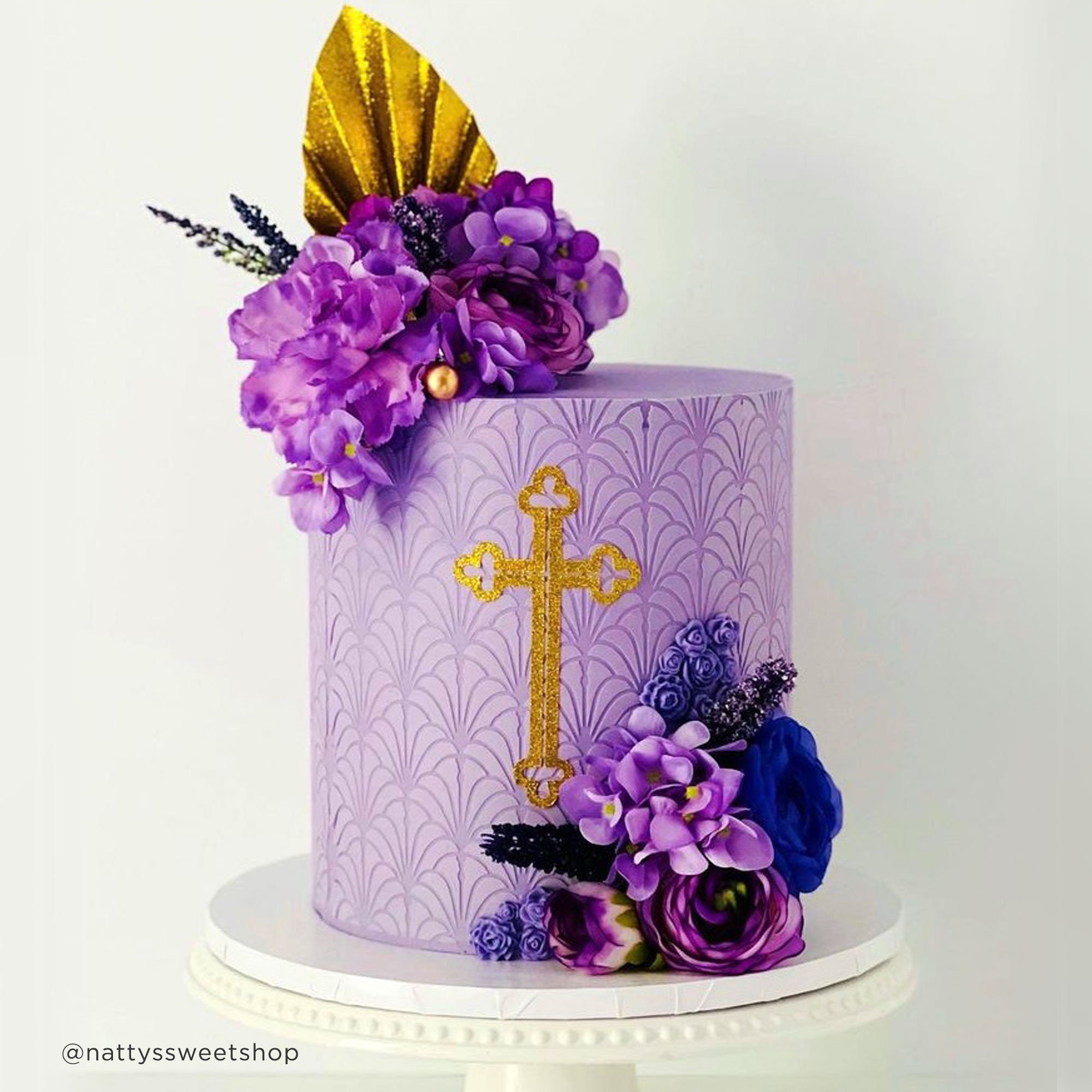 Louis Vuitton themed cake iced in butter icing with 3D han…