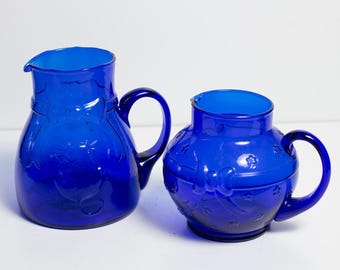 Glass Cobalt Blue Pitchers Crownford Italy Giftware Ball Ribbon and Cat Designs