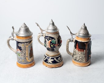 Vintage German Stoneware Beer Steins with Scenes and Figures with Pewter Lids