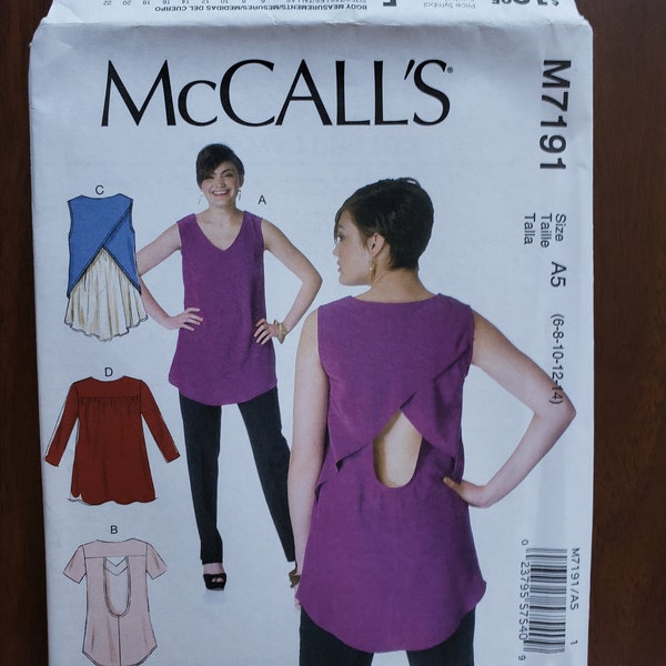 New, uncut sewing pattern, Misses’ Tops. McCall's pattern M7191, Size A5 (6-8-10-12-14), semi-fitted, pullover, criss-cross back, shaped hem