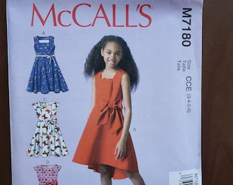 New, uncut sewing pattern, Children’s/Girls’ Dresses. McCall's pattern M7180, Size CCE (3-4-5-6), raised waist, lined bodice , ribbon