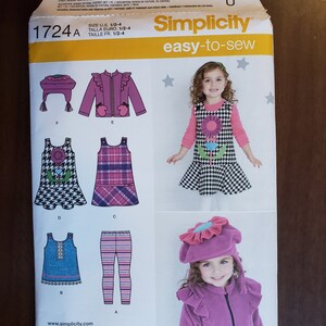 May include: Simplicity sewing pattern 1724A for sizes 1/2-4. The pattern includes instructions and diagrams for making a variety of clothing items, including a dress, leggings, a top, and a hat. The pattern is easy-to-sew and includes a variety of design options.