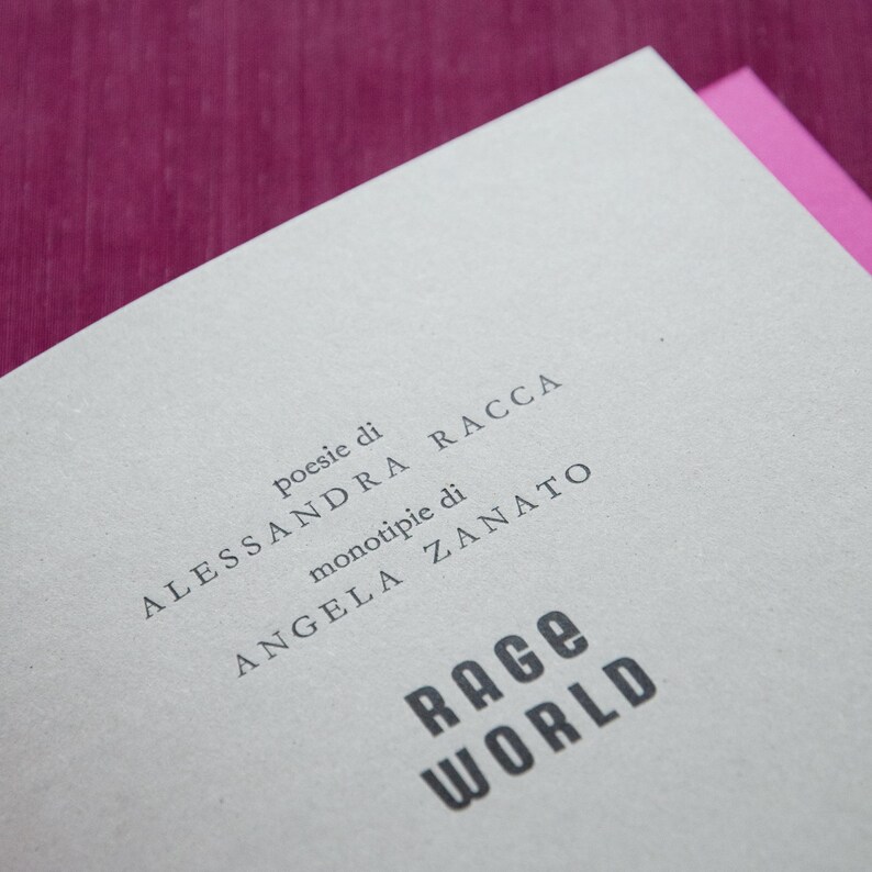 May include: A book cover with the title "Rage World" in bold, black letters. The text "Poesie di Alessandra Racca" and "monotipie di Angela Zanato" is printed in smaller, black letters.