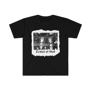 May include: Black t-shirt with a white distressed image of two people with the text "Denial of God" underneath.