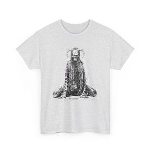 May include: A heather grey t-shirt with a black and white illustration of a horned, skeletal figure sitting with legs crossed. The text "Horrificus" is printed below the figure.
