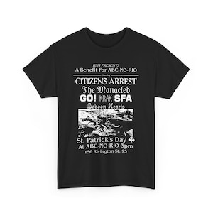 May include: Black t-shirt featuring white text promoting a benefit event. The text includes "BSM PRESENTS," "CITIZENS ARREST," "GO! KRAK SFA," and "St. Patrick's Day." The shirt also lists the venue and time.