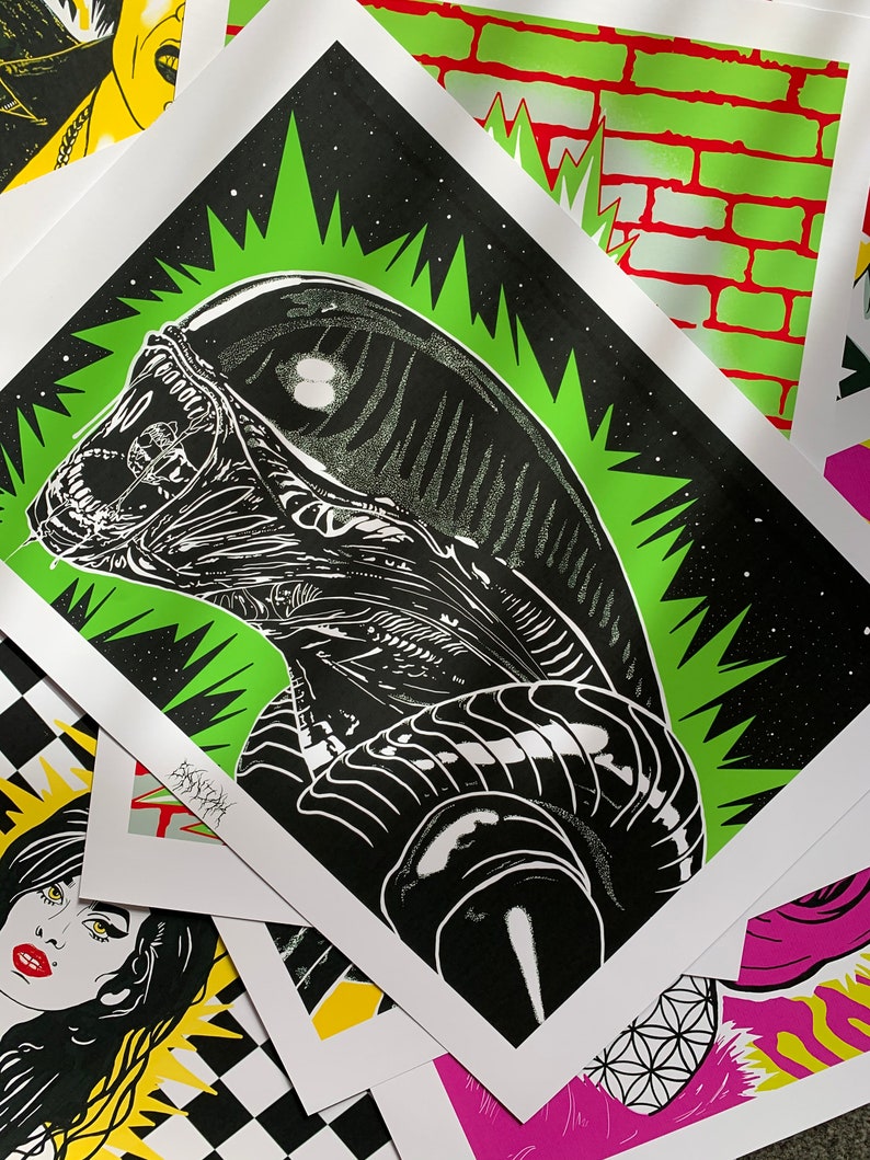 May include: Black and white illustration of an alien creature with a green starburst background. The alien has a large head and a long, thin body. The illustration is printed on a white background.