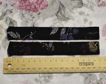 One pair of Dark Floral Sleeve Tabs