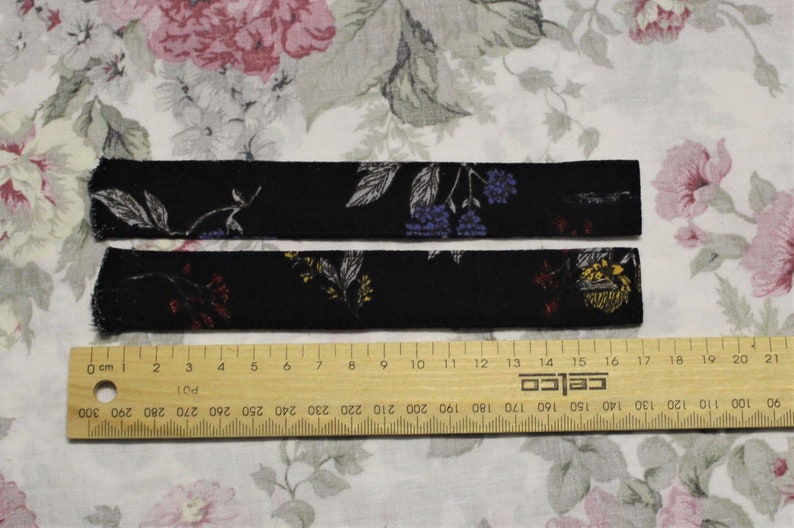 One pair of Dark Floral Sleeve Tabs image 1