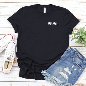 May include: Black t-shirt with the word "mama" embroidered on the left chest in white.