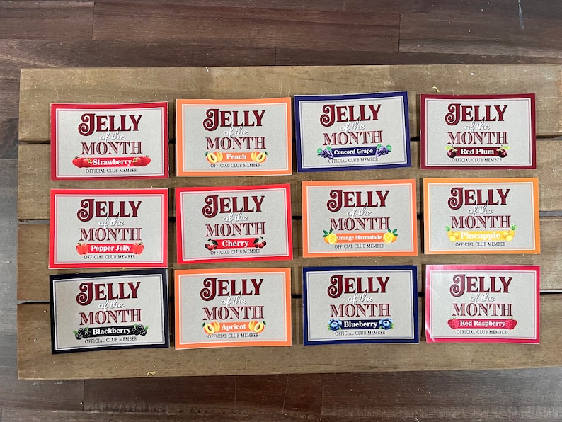 May include: Twelve colorful cards with the text "Jelly of the Month" and a different fruit or flavor listed on each card. The cards are arranged in four rows of three cards each.