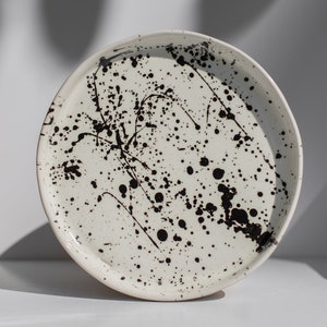 Black and white ceramic plates with footage