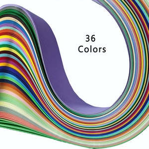 May include: A close-up of 36 colorful strips of paper, arranged in a curved shape. The paper is folded and layered, creating a rainbow effect. The text "36 Colors" is printed in black on a white background.