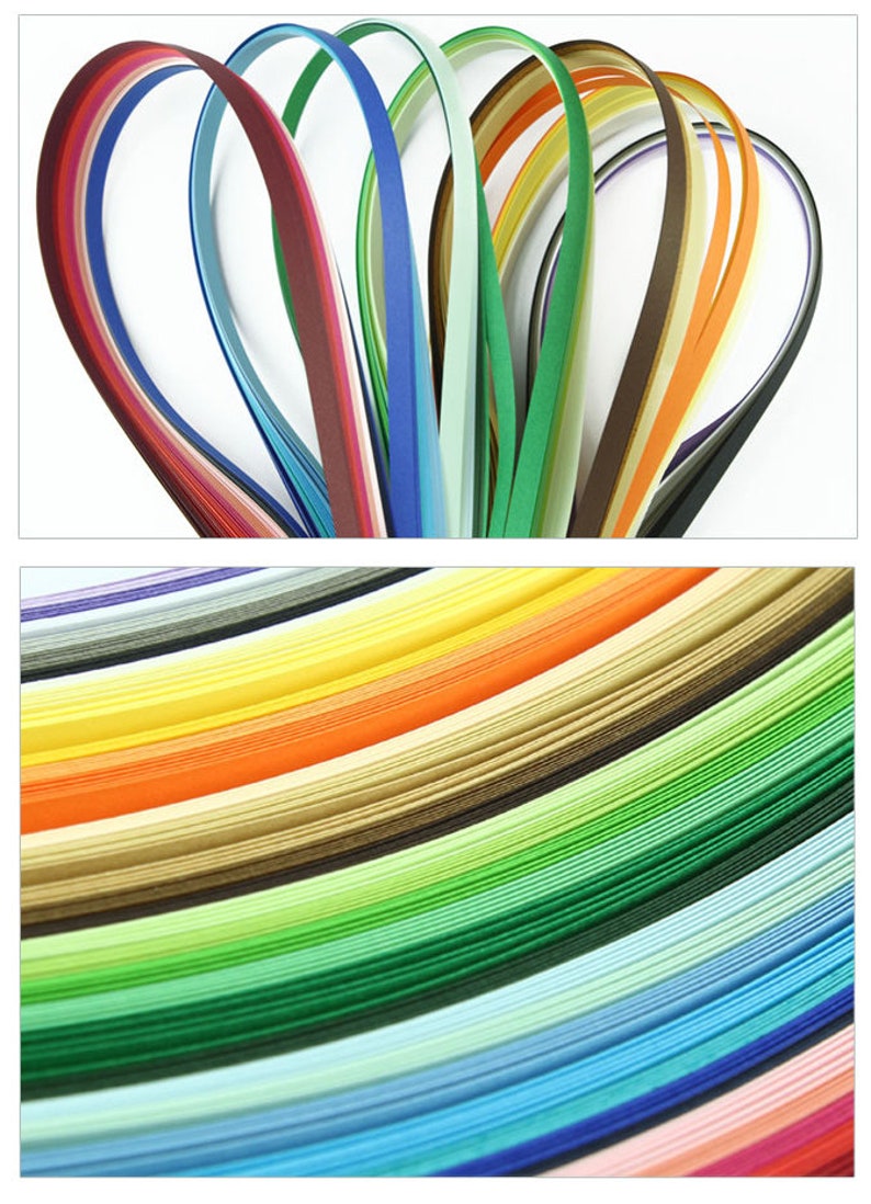 May include: Assortment of colorful paper strips, arranged in a fan shape and stacked in a rainbow pattern. The paper strips are thin and delicate, perfect for crafting and paper art.