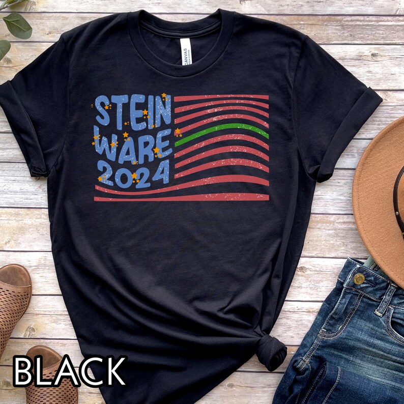 May include: Black t-shirt with a distressed American flag design and the text "STEIN WARE 2024" in blue and white.