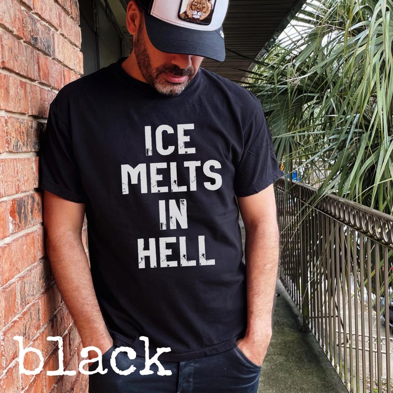 May include: Black t-shirt with the white text "ICE MELTS IN HELL". The word "black" is written in white at the bottom of the image. The person in the image is wearing a black and white trucker hat.