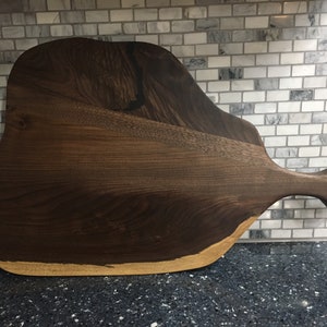 Hand made Walnut live edge serving/cutting board