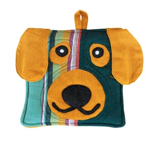 May include: A green and yellow striped pot holder with a dog face design. The dog has black eyes, a black nose, and a yellow mouth.