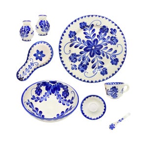 May include: A set of three ceramic mugs with a speckled, matte finish. The mugs are in shades of cream, light gray, and dark gray. Each mug has a simple, minimalist design, perfect for coffee or tea.